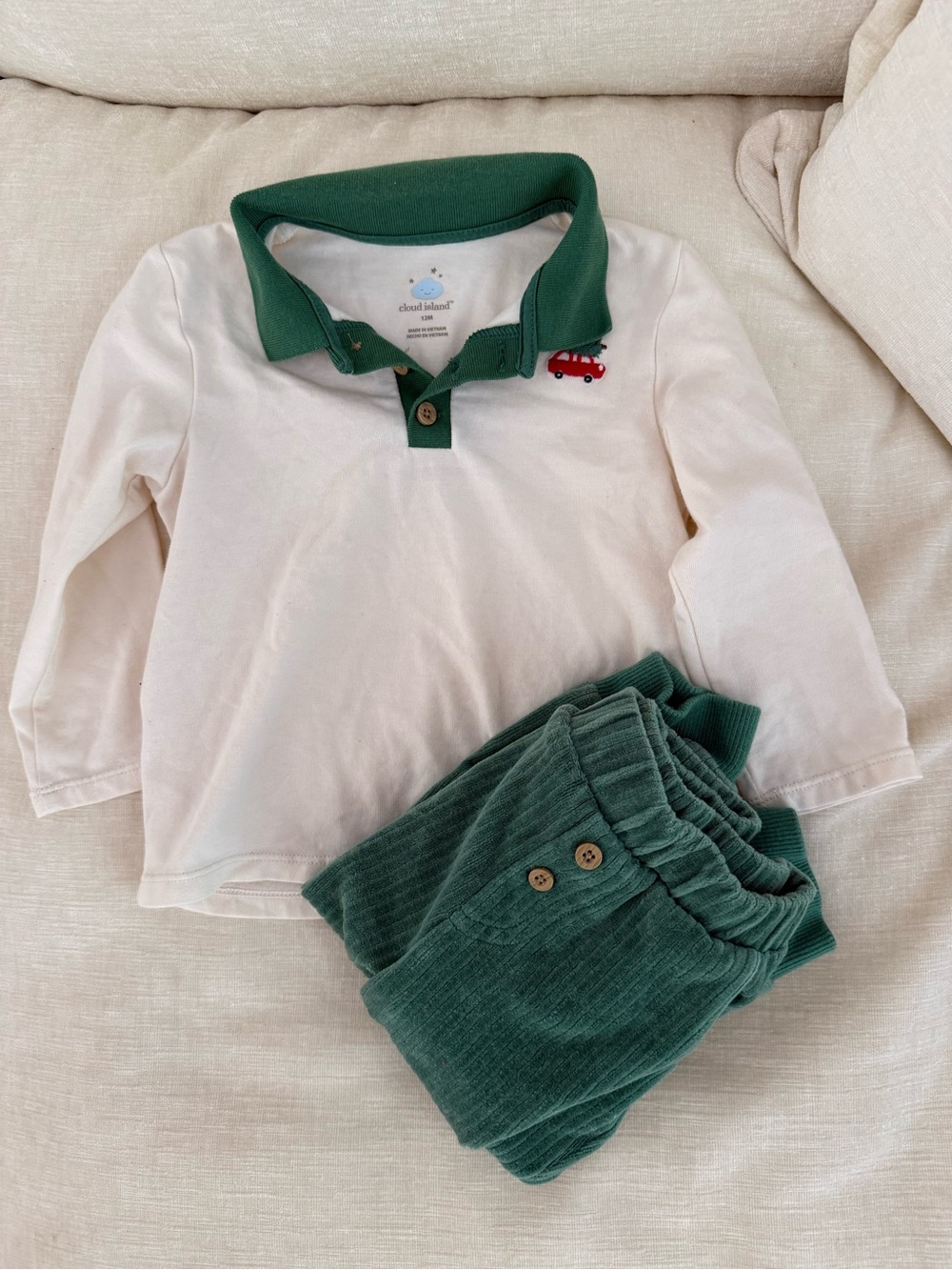 cloud island cream polo with green collar and red car detail
